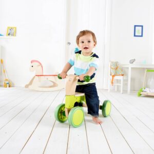 Loopfiets voor jonge kinderen met stevig frame en veilige handgrepen, stimuleert balans en motoriek in speelse omgeving.