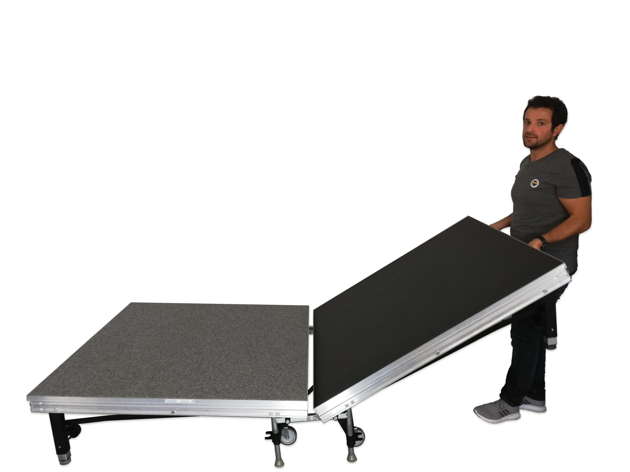 Podiumelement Speedi Vario, 125 x 250 cm, met verstelbare helling, man tilt een deel op. Geschikt voor kantine en leerplei...