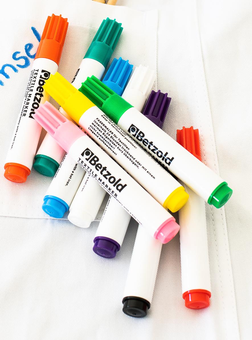 Kleurige textielpennen in diverse kleuren, 12 stuks, met witte huls en gekleurde doppen, geschikt voor textiel.