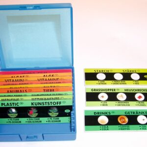 Set van 48 microscoopglaasjes in blauwe doos, met labels voor verschillende biologische voorbeelden en materialen.