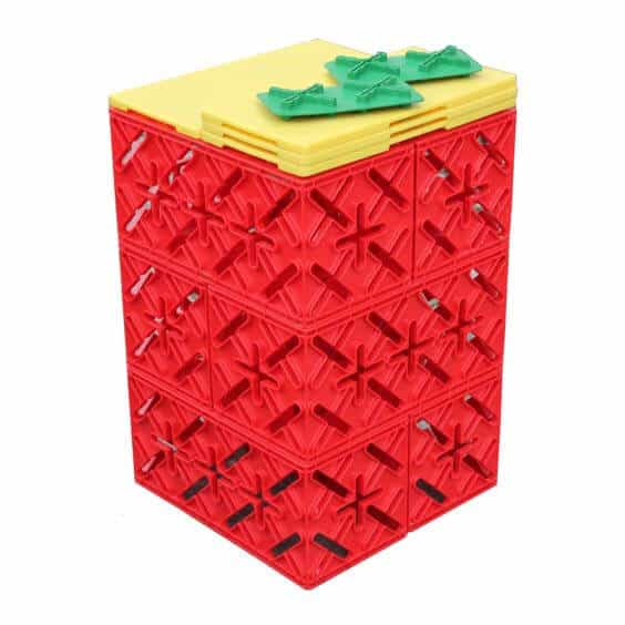 Kleurige X-Block HET Bouwconcept mini set van 6 stuks, bestaande uit rode en gele bouwstenen met groene accessoires.